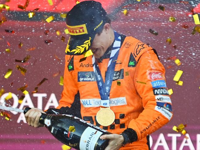 BAKU, AZERBAIJAN - SEPTEMBER 15: Race winner Oscar Piastri of Australia and McLaren celebrates on the podium during the F1 Grand Prix of Azerbaijan at Baku City Circuit on September 15, 2024 in Baku, Azerbaijan. (Photo by James Sutton/Getty Images)