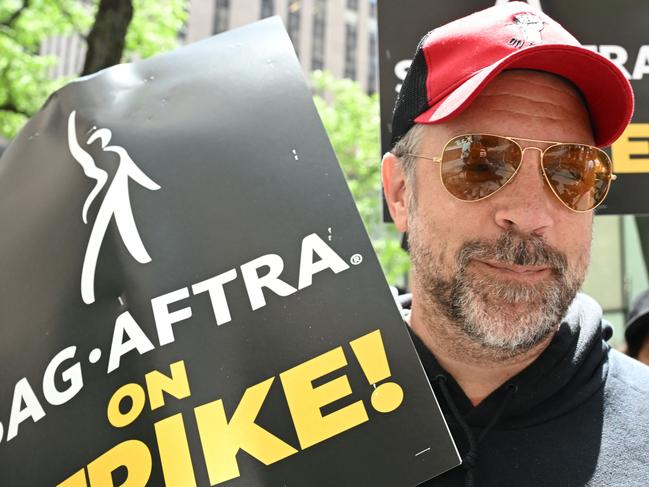 US actor Jason Sudeikis joins members of the Writers Guild of America and the Screen Actors Guild as they walk a picket line outside NBC Universal in New York City on July 14, 2023. Tens of thousands of Hollywood actors went on strike at midnight July 13, 2023, effectively bringing the giant movie and television business to a halt as they join writers in the first industry-wide walkout for 63 years. (Photo by TIMOTHY A. CLARY / AFP)