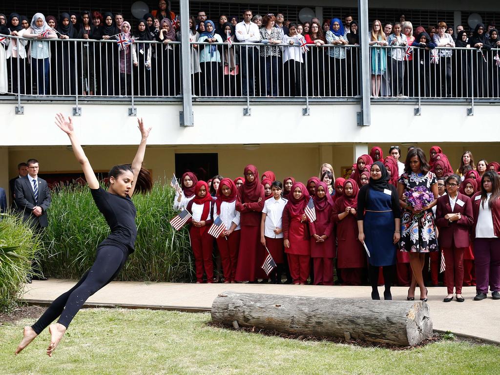 US First Lady Michelle Obama watches an interpretive dance performance during a welcome for her arrival at Mulberry School for Girls during a visit as part of the US government’s ‘Let Girls Learn’ initiative in east London on June 16, 2015. Picture: AFP