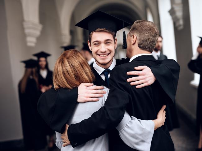 CAREERS. Parents congratulate the student, who finish their studies at the university. He graduates. They are very happy about this. University graduate. Picture: iStock