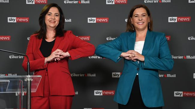 Labor Premier Annastacia Palaszczuk, left, and LNP leader Deb Frecklington bump elbows at the start of the debate in Brisbane. Picture: NCA NewsWire/Dan Peled<br/>