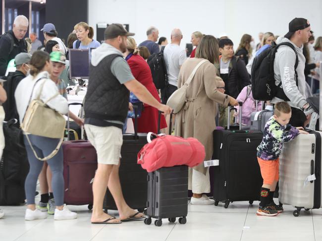 Melbourne airport as people head off for the Easter Break. Pics in the Virgin checkin. Friday, April 7, 2023. Picture: David Crosling