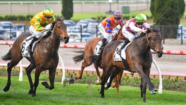 Mornington Glory (green cap) holds on to win the Moir Stakes at The Valley on Saturday. Photo: Pat Scala/Getty Images.