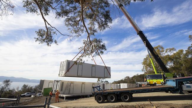 Shipping containers arrive at the University of Tasmania ahead of their installation as student accommodation. Picture: RICHARD JUPE