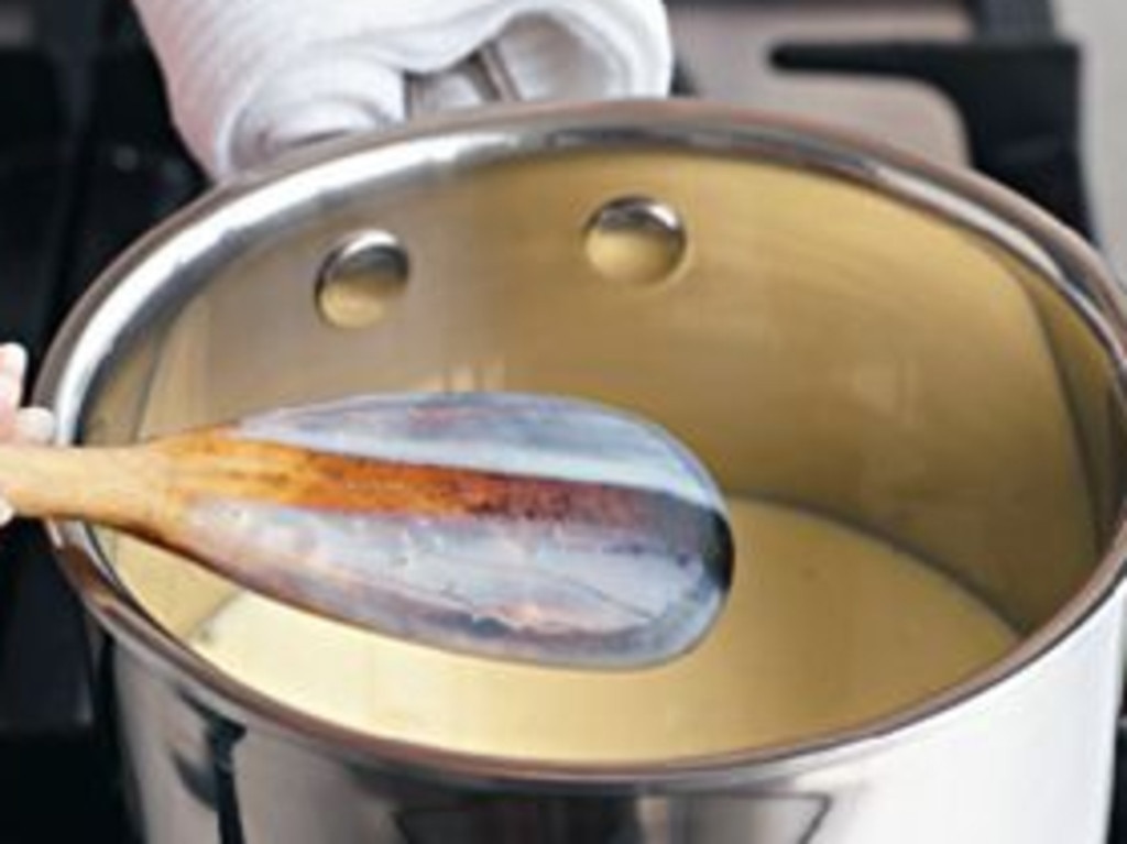 The secret to cooking stirred custard is to cook it in a large saucepan over medium-low heat.