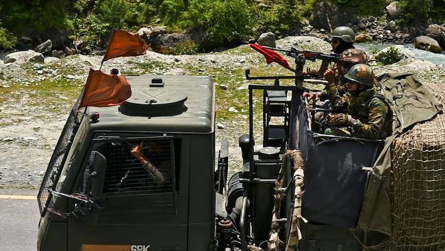 Indian army soldiers ride in a convoy along a highway leading towards Leh, bordering China. Picture: AFP