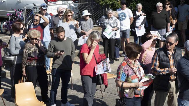 Locals wait in line to vote at Panania Public school. Picture; Matthew Vasilescu