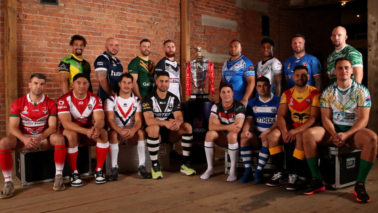 MANCHESTER, ENGLAND - OCTOBER 10: (Back Row L-R) Ashton Golding of Jamaica, Dale Ferguson of Scotland, James Tedesco of Australia, Sam Tomkins of England, Junior Paulo of Samoa, Kevin Naiqama of Fiji, Nathan Brown of Italy, George King of Ireland (Front Row L-R) Elliot Kear of Wales, Jason Taumalolo of Tonga, Benjamin Garcia of France, Jessa Bromwich of New Zealand, Mitchell Moses of Lebanon, Jordan Meads of Greece, Rhyse Martin of Papua New Guinea and Brad Takairangi of Cook Islands pose for a photograph during the Rugby League World Cup 2021 Tournament Launch events at the Science and Industry Museum on October 10, 2022 in Manchester, England. (Photo by Jan Kruger/Getty Images for RLWC2021)