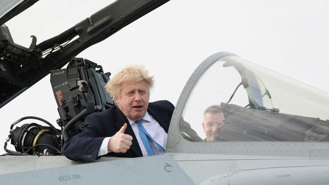 British Prime Minister Boris Johnson gives a thumbs-up from a military aeroplane as the UK announced a new alliance with Ukraine and Poland. AFP.
