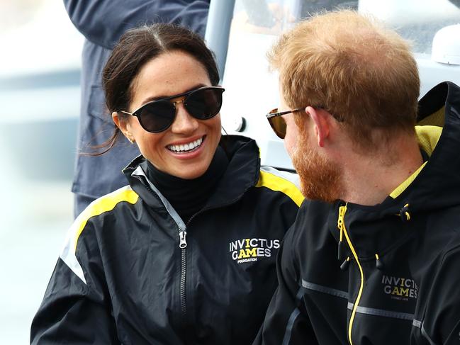 Meghan, Duchess of Sussex and Prince Harry, Duke of Sussex watch on during the Elliott 7 Team racing during the Sailing on day two of the Invictus Games Sydney 2018. Picture: Getty