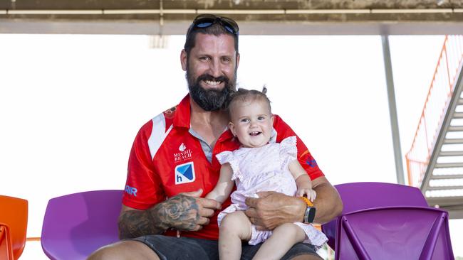 Father and daughter Chris and Luella Bryan enjoying the NTFL prelim finals on Saturday afternoon. Picture: Floss Adams.