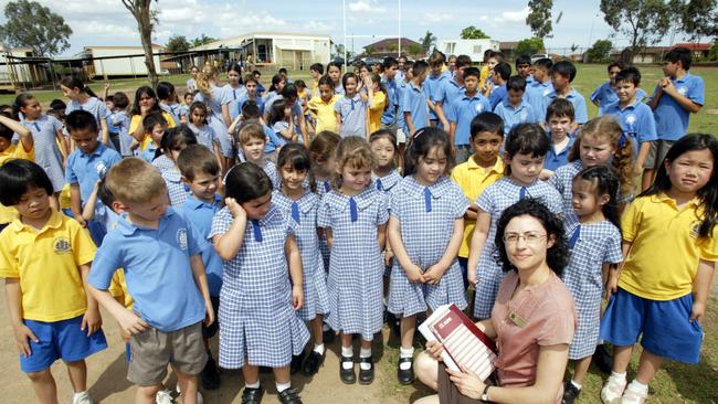 An English as a Second Language teacher with students at Governor Philip King Public School.