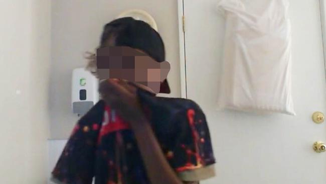 A youth captured on camera inside the chiropractic clinic in Alice Springs.