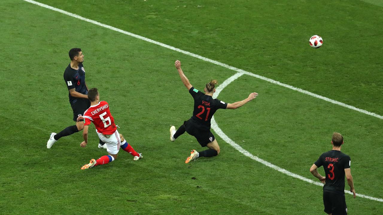 Denis Cheryshev of Russia scores his team's first goal