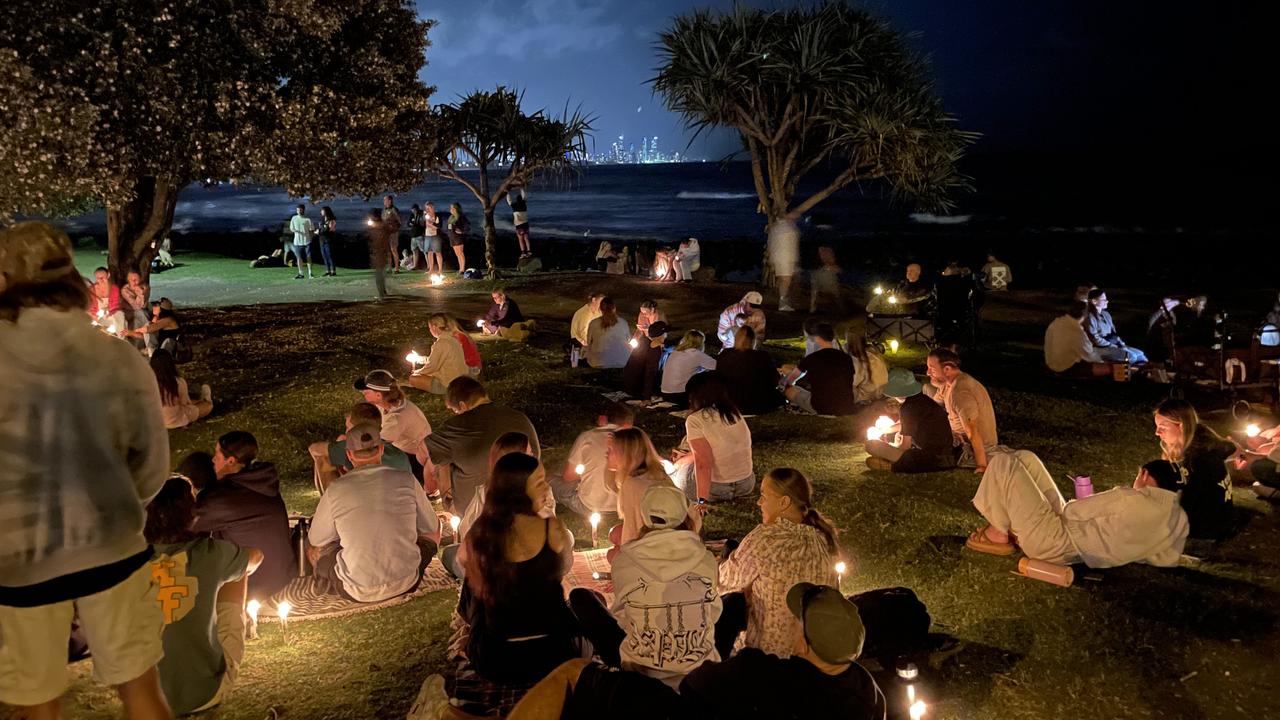 Hundreds have gathered at Burleigh Heads for a candlelight vigil for young Gold Coast man Cameron Duce.