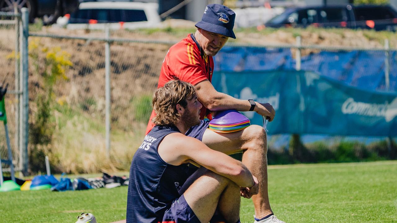 Burgess talking to Crow Luke Pedlar. Picture: Adelaide Football Club