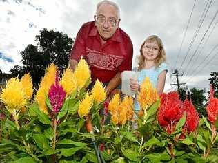 DIGGING IT: Wally Estreich of Goonellabah and his granddaughter Kaitlyn Willers from the Gold Coast, tend to his garden. Picture: Cathy Adams