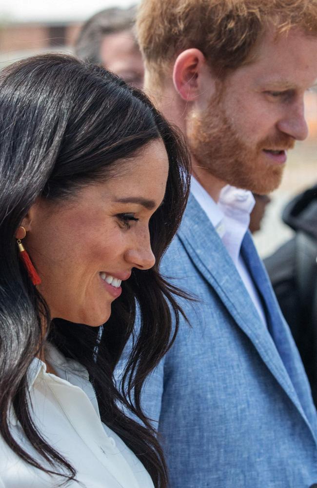 Britain's Prince Harry, Duke of Sussex and Meghan, Duchess of Sussex leave the Youth Employment Services Hub in Tembisa township, Johannesburg. Picture: AFP