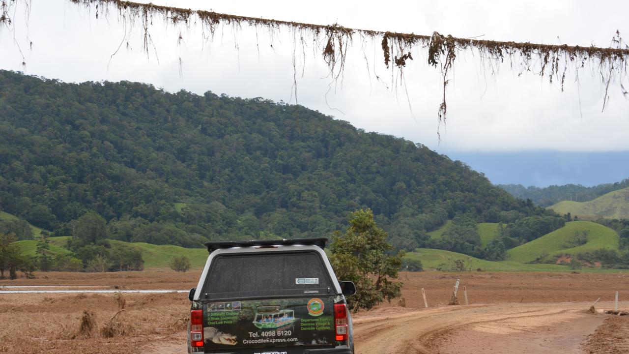 Debris on a powerline shows how high the flood was at Daintree Village. Picture: Bronwyn Farr