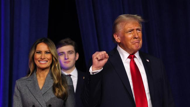 Donald Trump takes the stage with his wife Melania to address supporters at his rally in Florida. Picture: Reuters/Brian Snyder