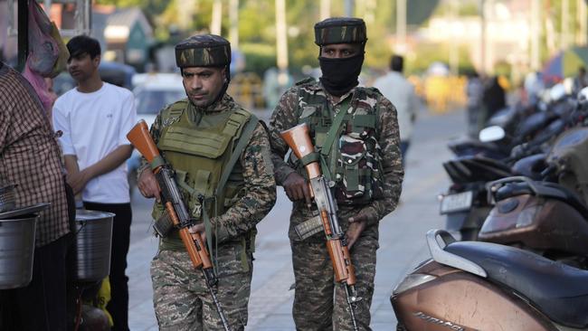 Indian paramilitary soldiers patrol in Kashmir. Picture: AP Photo/Mukhtar Khan