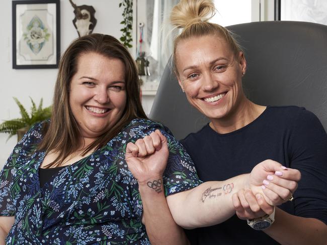 OlympianÃs Lisa Smith and Erin Phillips at Ink Haus in Hackney, getting Olympic tattoos, Friday, Oct. 1, 2021. Picture: MATT LOXTON