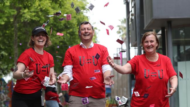 HIV pharmacist Kate Mackie who put on a Jungle Body Dance Workout along with Professor Eugene Athan and care co-ordinator Helen Fay among the condom giveaway in Little Malop Street. Picture: Alan Barber