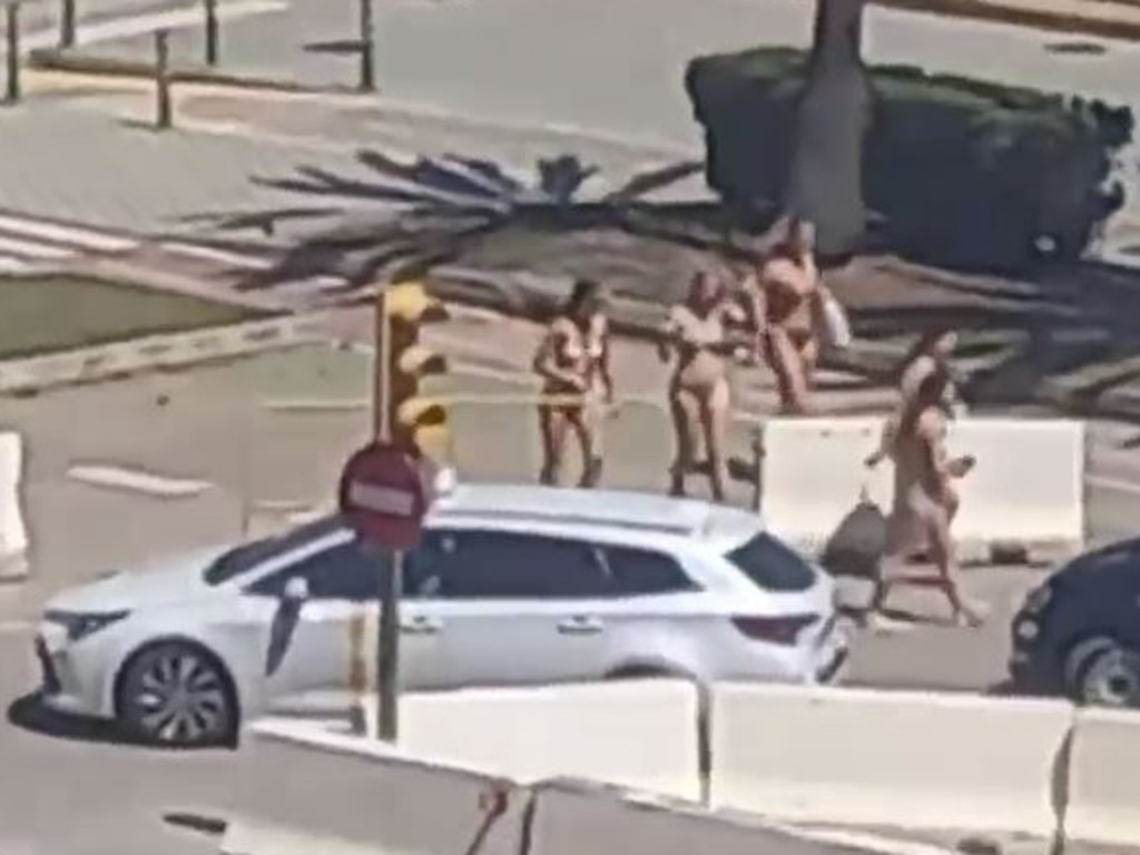 A group of tourists was seen walking around in Palma wearing just bikinis