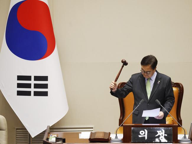 South Korean National Assembly Speaker Woo Won-shik uses the gavel to announce that "the voting cannot take place" because the quorum was not reached during a plenary session of the impeachment vote of President Yoon Suk Yeol n Saturday. Picture: Getty Images