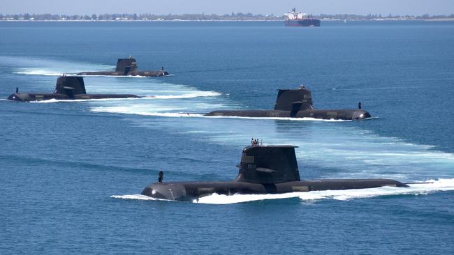 Three out of four of these Collins Class submarines, HMAS Collins, HMAS Farncomb, HMAS Dechaineux and HMAS Sheean, seen here in formation while transiting through Cockburn Sound, Western Australia, were named after Tasmanians.