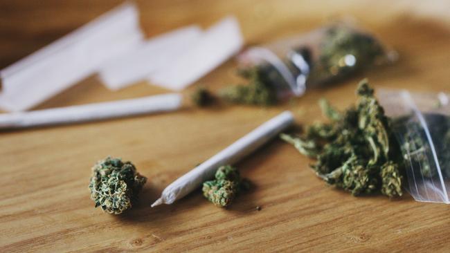 Shot of dried marijuana and a rolled joint. Cannabis clipseal bag generic image. Picture: iStock