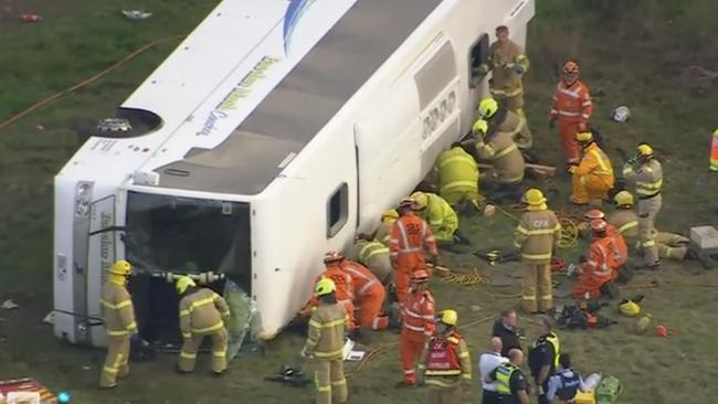 Twenty-one students and an adult have been taken to hospital after a school bus rolled in Eynesbury, West of Melbourne. Picture: Nine News