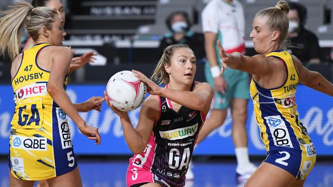 Georgie Horjus of the Thunderbirds looks to pass the ball under pressure from Maddy Turner of the Swifts during the round 14 Super Netball match between Sydney Swifts and Adelaide Thunderbirds at Nissan Arena in Brisbane. Picture: Albert Perez/Getty Images