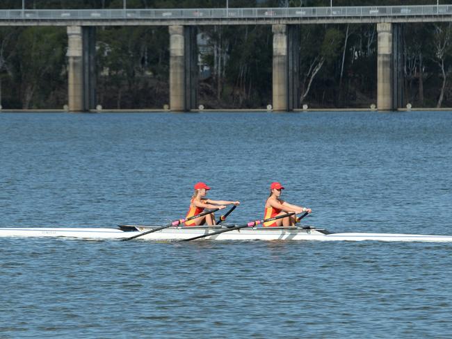 A pair of Stuartholme School rowers head out on to the course during the Queensland Secondary Schools Rowing Championships in Rockhampton.