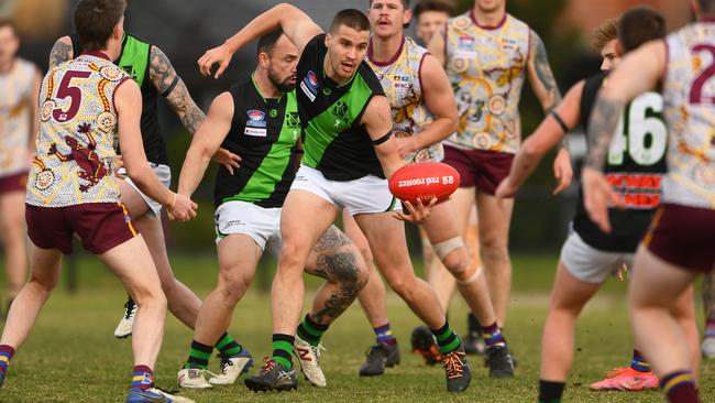 SFNL: Doveton’s William Smith handballs. Picture: Josh Chadwick