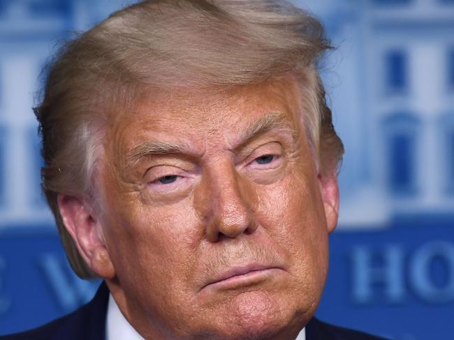 US President Donald Trump pauses as he speaks during a press briefing in the James S. Brady Press Briefing Room at the White House, in Washington, DC on August 19, 2020. (Photo by Brendan Smialowski / AFP)