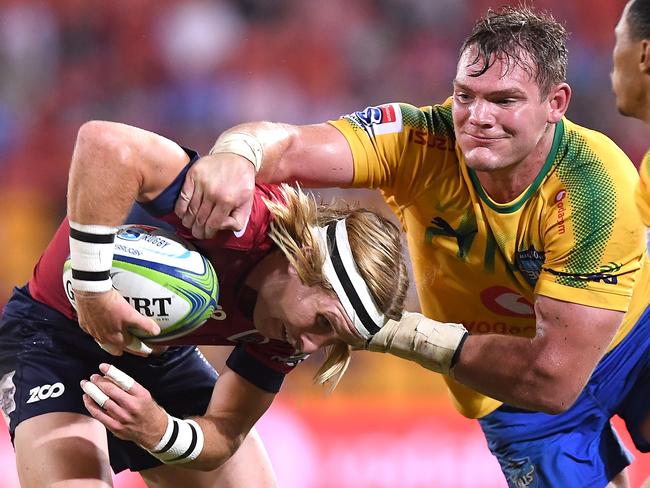 Tate McDermott escapes the clutches of a big Bull. Picture: Getty