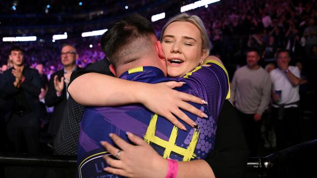 Littler celebrates with his girlfriend Eloise Milburn. (Photo by Justin Setterfield/Getty Images)