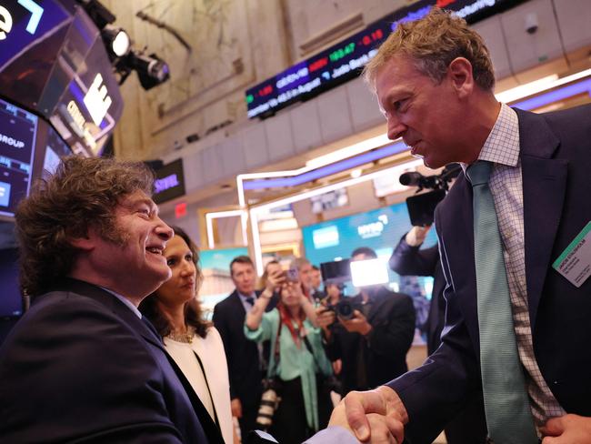 Argentina’s President, Javier Milei, shakes hands with Rio Tinto CEO Jakob Stausholm on the floor of the New York Stock Exchange last month. Picture: Getty Images