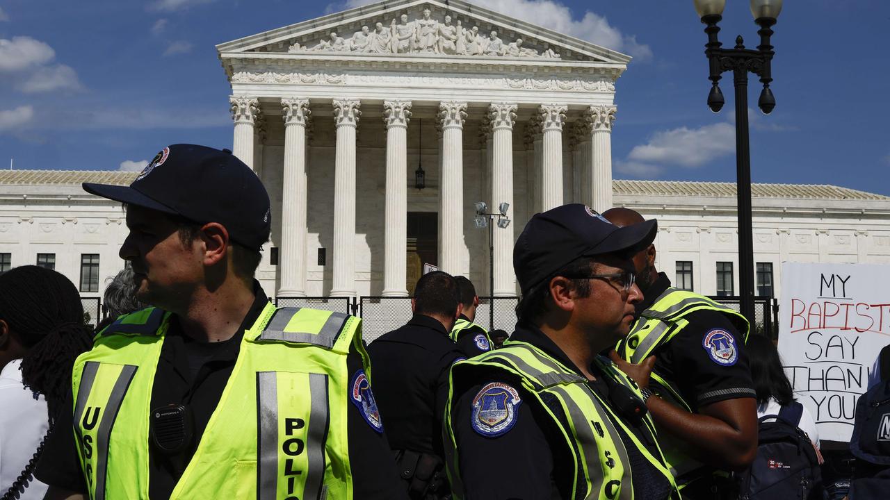 Police officers stand in the crowd as protesters gather for a demonstration over the decision overturning Roe vs. Wade in front of the US Supreme Court on June 26, 2022. Pictures: Anna Moneymaker/Getty Images/AFP.