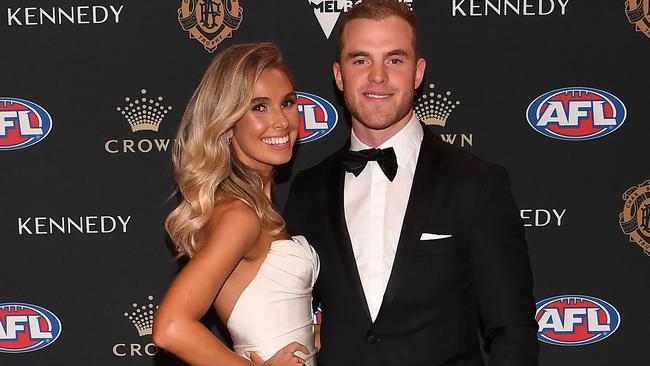 Tom Mitchell of the Hawthorn Hawks and his partner Hannah Davis arrive at the 2019 Brownlow Medal ceremony at the Crown Palladium in Melbourne in Melbourne, Monday, September 23, 2019. (AAP Image/Julian Smith) NO ARCHIVING