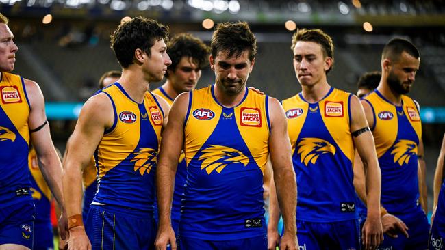 Andrew Gaff (centre) of the Eagles looks dejected after a loss during the 2022 AFL Round 01 match between the West Coast Eagles and the Gold Coast Suns at Optus Stadium on March 20, 2022 In Perth, Australia. (Photo by Daniel Carson/AFL Photos via Getty Images)