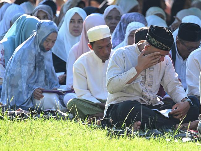 Villagers gather for prayers in Peukan Bada, Aceh province. Picture: AFP