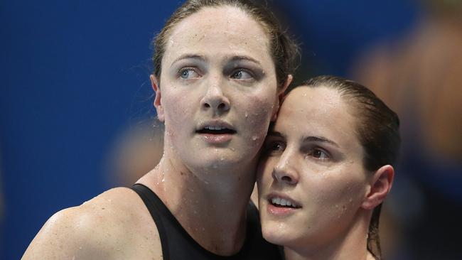 Ditch the medal predictions: Cate Campbell with sister Bronte after finishing sixth and fourth in the women’s 100m freestyle final on day six of the swimming in Rio. Picture: Brett Costello