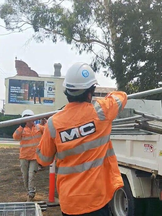 Protesters stood between workers and their trucks to prevent them from unloading equipment.