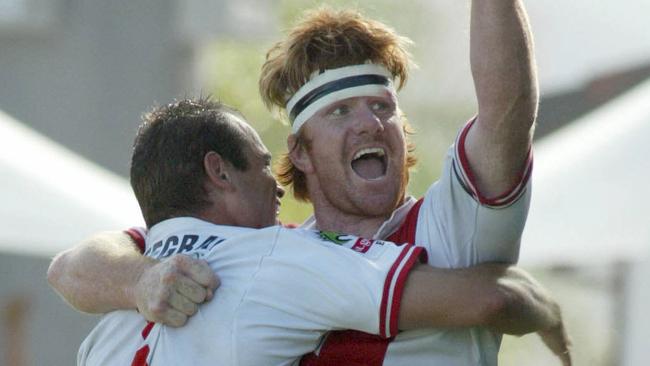 Player Lance Thompson (r) celebrating Rugby league — St George Illawarra vs Parramatta NRL match at WIN Stadium in Wollongong, NSW 23 Mar 2003. a/ct /Rugby/Australia