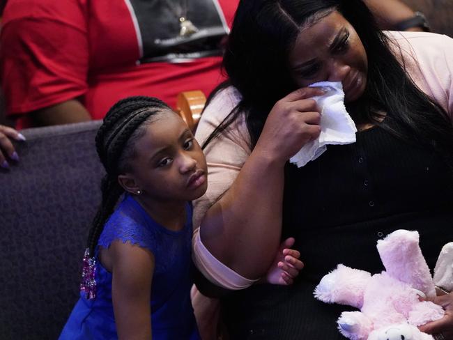 Roxie Washington weeps with Gianna Floyd, the six-year-old daughter of George Floyd. Picture: AP