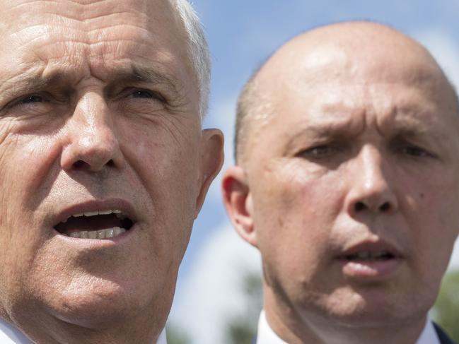 Australian Prime Minister Malcolm Turnbull (left) and Member for Dickson Peter Dutton speak to media in Murrumba Downs, Brisbane, Tuesday, April 3, 2018. Mr Turnbull announced funding for a $150 million upgrade to the Bruce Highway. (AAP Image/Glenn Hunt) NO ARCHIVING, EDITORIAL USE ONLY