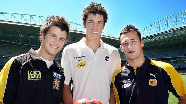 Matthew Kreuzer (pick one) with Trent Cotchin (pick two) and Chris Masten (pick three).