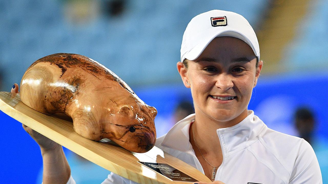 Ash Barty poses with her trophy after winning the Yarra Valley Classic women's singles final tennis match against Spain's Garbine Muguruza in Melbourne.